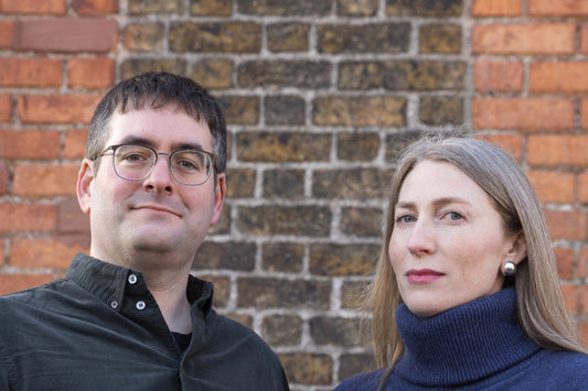 Eoin Purcell (left) and Blathnaid Healy (Right) standing outdoors with a brick wall as a background